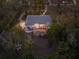 Aerial view of a single-story house with a pool and lush landscaping at 1021 99Th Nw St, Bradenton, FL 34209