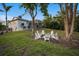 Landscaped backyard with fire pit and seating area at 1021 99Th Nw St, Bradenton, FL 34209