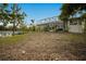 Elevated backyard view of home with screened enclosure at 1021 99Th Nw St, Bradenton, FL 34209