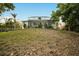 Elevated backyard view of home with screened enclosure at 1021 99Th Nw St, Bradenton, FL 34209