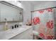 Clean bathroom with a shower/tub combo and coral-themed decor at 1021 99Th Nw St, Bradenton, FL 34209