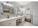 Double vanity bathroom with large mirrors and gray shower curtain at 1021 99Th Nw St, Bradenton, FL 34209