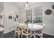 Bright dining area with white table and chairs near a large window at 1021 99Th Nw St, Bradenton, FL 34209