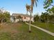 Single story home with lush landscaping and walkway at 1021 99Th Nw St, Bradenton, FL 34209