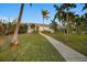 Single-story house with walkway and palm trees at 1021 99Th Nw St, Bradenton, FL 34209