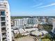 Aerial view of a modern building with a pool and city views at 111 S Pineapple Ave # 607, Sarasota, FL 34236