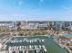 Aerial view of waterfront property with many boats and a city skyline at 111 S Pineapple Ave # 607, Sarasota, FL 34236