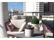 Relaxing balcony with city views and comfortable seating at 111 S Pineapple Ave # 607, Sarasota, FL 34236