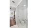 Modern bathroom with glass-enclosed toilet at 111 S Pineapple Ave # 607, Sarasota, FL 34236