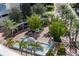 Elevated view of a community courtyard with fountain, benches, and palm trees at 111 S Pineapple Ave # 607, Sarasota, FL 34236