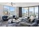 Modern living room with sectional sofa and stunning city views at 111 S Pineapple Ave # 607, Sarasota, FL 34236