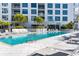 Resort-style pool with plenty of lounge chairs for relaxing at 111 S Pineapple Ave # 607, Sarasota, FL 34236