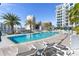 Resort-style pool with lounge chairs and city views at 111 S Pineapple Ave # 607, Sarasota, FL 34236