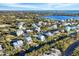 Aerial view of waterfront community with various homes and canals at 115 Burns Rd, Terra Ceia, FL 34250