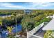 Aerial view shows home's waterfront location and landscape at 115 Burns Rd, Terra Ceia, FL 34250