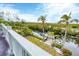 Waterfront backyard with dock and lush landscaping at 115 Burns Rd, Terra Ceia, FL 34250