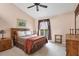 Cozy bedroom with a queen-size bed and private balcony access at 115 Burns Rd, Terra Ceia, FL 34250