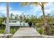 Wooden dock with boat lift on a calm canal at 115 Burns Rd, Terra Ceia, FL 34250