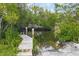 Wooden dock extending into calm waterway at 115 Burns Rd, Terra Ceia, FL 34250