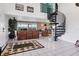 Elegant entryway with a spiral staircase and tiled floors at 115 Burns Rd, Terra Ceia, FL 34250