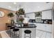 Well-equipped kitchen with black countertop and white cabinetry at 115 Burns Rd, Terra Ceia, FL 34250