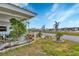 Landscaped yard with palm trees and paved pathway at 1204 43Rd E Ave, Ellenton, FL 34222