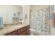 Bathroom with granite vanity and shower/tub combo at 12563 Felice Dr, Venice, FL 34293