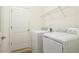 Laundry room with washer, dryer, and shelving at 12563 Felice Dr, Venice, FL 34293