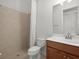 Clean bathroom with shower/tub combo and wood vanity at 13013 Ramblewood Trl, Bradenton, FL 34211