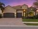 Stunning two-story house with a three-car garage and well-manicured landscaping at 13013 Ramblewood Trl, Bradenton, FL 34211