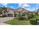 Spacious two-car garage and nicely landscaped front yard at 13013 Ramblewood Trl, Bradenton, FL 34211