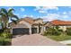 Stunning two-story house with tile roof and large driveway at 13013 Ramblewood Trl, Bradenton, FL 34211