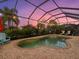 Relaxing kidney-shaped pool and spa with screened enclosure at 13013 Ramblewood Trl, Bradenton, FL 34211