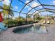 Inviting screened pool and spa with comfortable lounge chairs at 13013 Ramblewood Trl, Bradenton, FL 34211