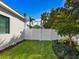 Well-maintained backyard featuring a privacy fence and manicured landscaping at 1519 Harbor Dr, Sarasota, FL 34239