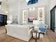 Bright living room featuring stone accent wall, neutral furniture, and recessed lighting at 1519 Harbor Dr, Sarasota, FL 34239