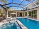 Gorgeous screened-in pool and spa area with ample seating and luxurious lounge chairs at 1519 Harbor Dr, Sarasota, FL 34239