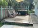 Small patio with chairs and a grill at 1703 Center Rd, Terra Ceia, FL 34250