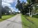 Quiet residential street with mature trees and well-maintained lawns at 1703 Center Rd, Terra Ceia, FL 34250