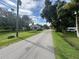 Residential street lined with houses and lush landscaping at 1703 Center Rd, Terra Ceia, FL 34250