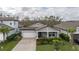 Aerial view of a gray house with landscaping and driveway at 1925 146Th E Ter, Parrish, FL 34219