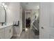 Bathroom with walk-in shower, double vanity, and gray tile floors at 1925 146Th E Ter, Parrish, FL 34219