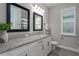 Bathroom with double vanity, granite countertop, and framed mirrors at 1925 146Th E Ter, Parrish, FL 34219