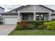 Gray house exterior with landscaping and brick driveway at 1925 146Th E Ter, Parrish, FL 34219