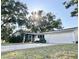 Charming ranch home with a spacious driveway and mature landscaping at 2040 Pine Ridge Dr, Clearwater, FL 33763