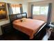 Main bedroom with king-size bed and lots of natural light at 2040 Pine Ridge Dr, Clearwater, FL 33763