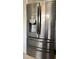 Stainless steel refrigerator with French doors and bottom freezer at 2040 Pine Ridge Dr, Clearwater, FL 33763