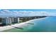 Aerial view of beachfront property with ocean, beach, and high rise building at 2295 Gulf Of Mexico Dr # 115S, Longboat Key, FL 34228