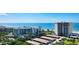 Aerial view of beachfront high rise building and parking at 2295 Gulf Of Mexico Dr # 115S, Longboat Key, FL 34228