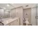 Bathroom with shower and white vanity at 2295 Gulf Of Mexico Dr # 115S, Longboat Key, FL 34228